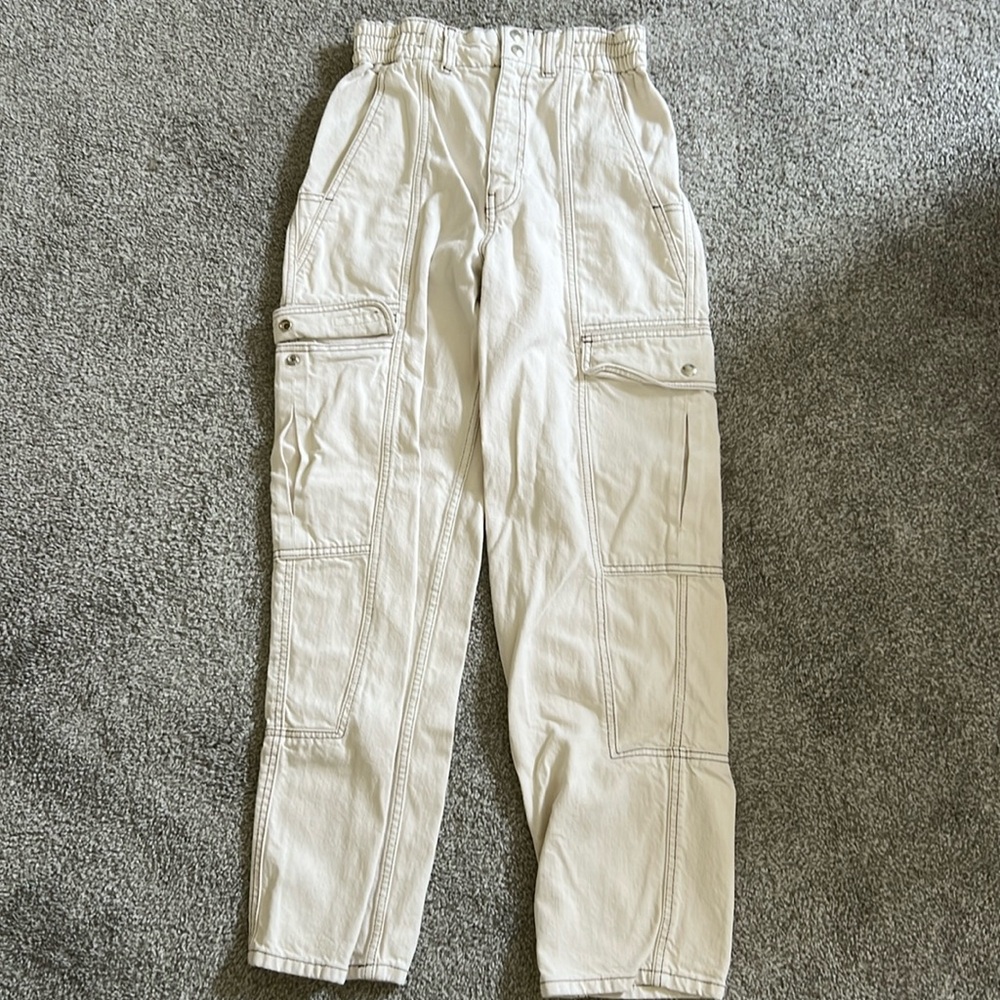BDG cargo skate pants. Waist 27, Leg 32. Colors: cream with brown stitching.